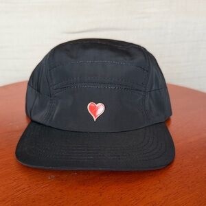 Black Five-Panel Running Cap w/           Gold Rim Red Heart Pin